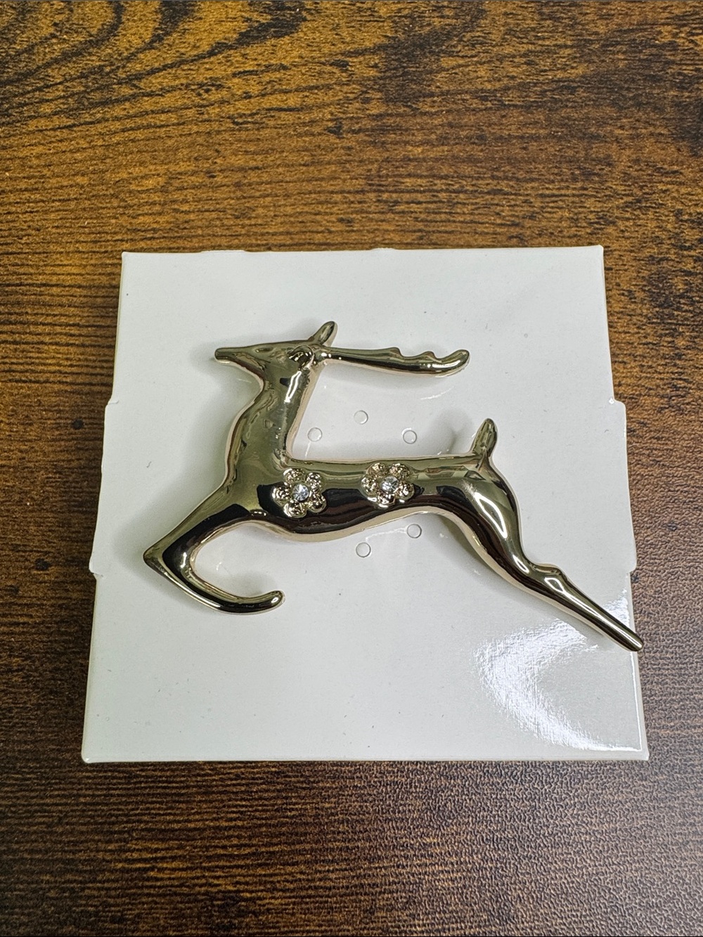 Gold-tone Reindeer Brooch with Crystal Accents
